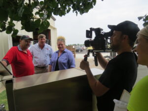 Fast Eddy, Stuart Powell, Diva Q and her Film Crew checking out the Cookshack Pellet Grill.